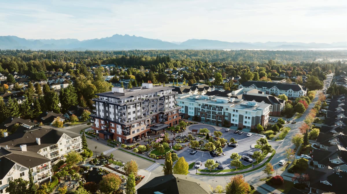 Sweeping aerial rendering of a mixed residential community with mountains on the horizon