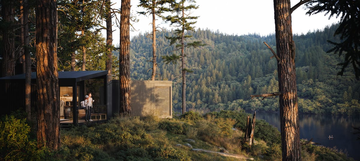 Rendering of a lakeside cabin in a forested setting